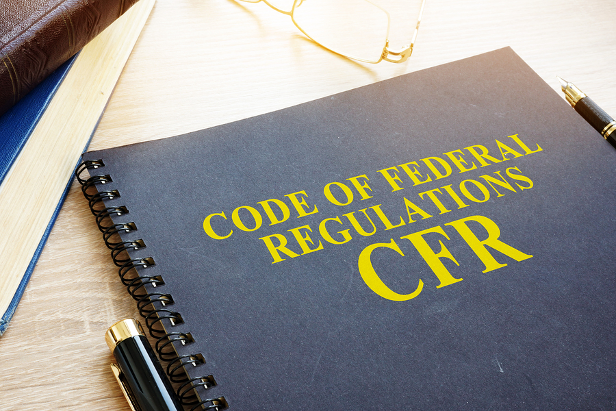 Code of Federal Regulations (CFR) and glasses.